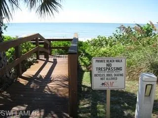 a view of a sign board with an ocean view