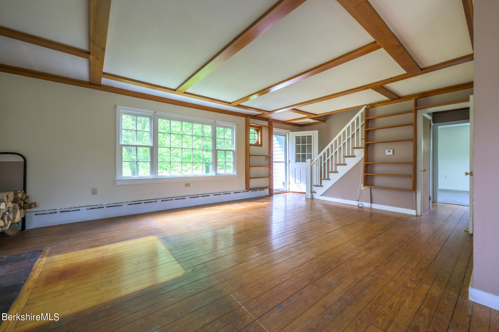 19 Anthony Road Richmond, MA 01201 - Photo 4 of 40 a view of an empty room with a window and wooden floor