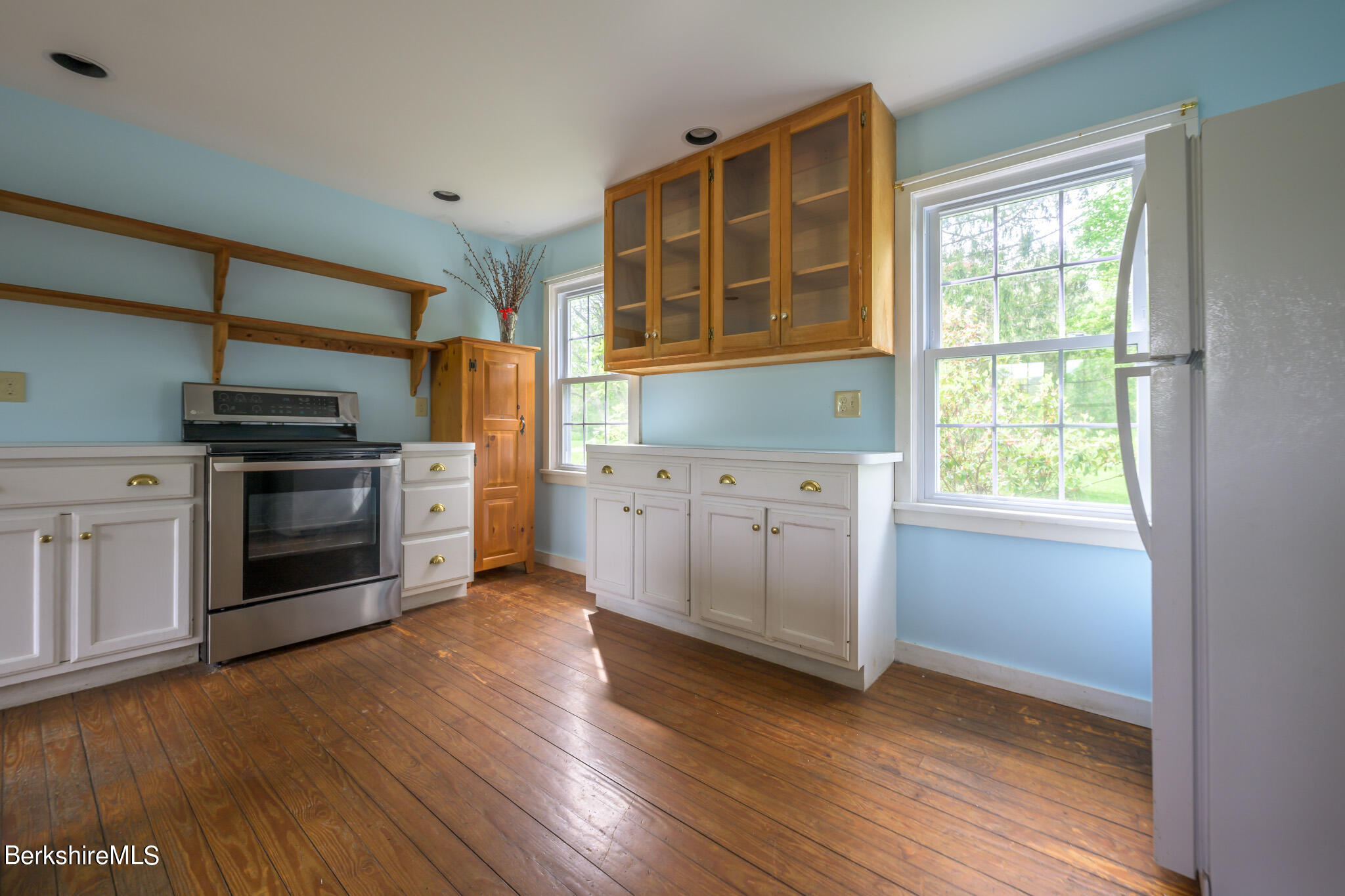 19 Anthony Road Richmond, MA 01201 - Photo 7 of 40 a kitchen with stainless steel appliances granite countertop a stove and a refrigerator
