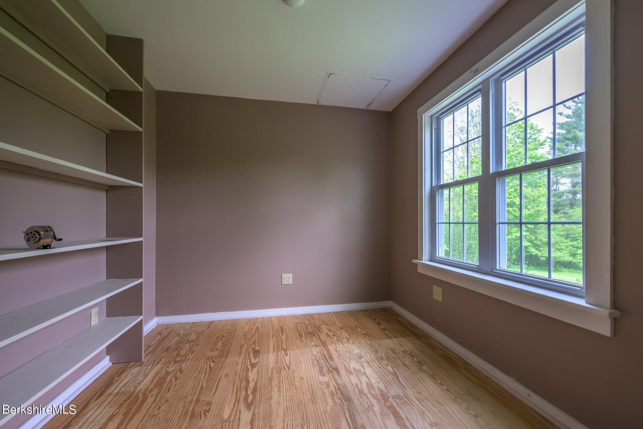 19 Anthony Road Richmond, MA 01201 - Photo 9 of 40 a view of an empty room with a window and wooden floor