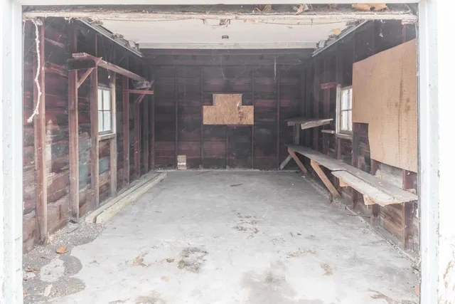 a view of a house with a bench