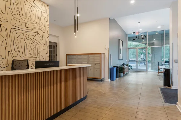 a open kitchen with stainless steel appliances granite countertop a refrigerator and a sink