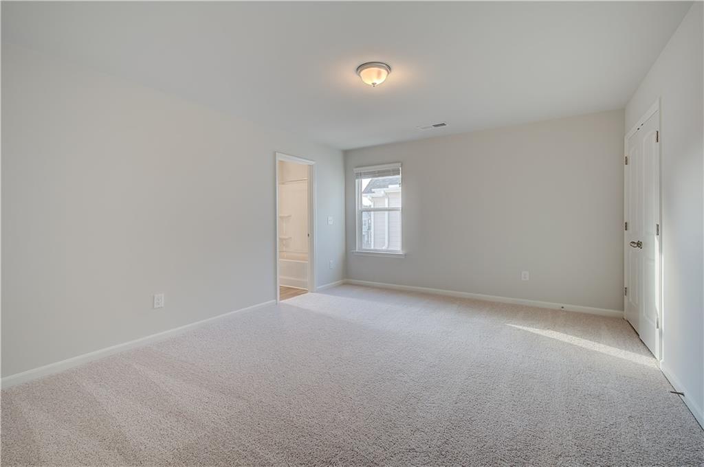 113 St Anne's Place Covington, GA 30016 - Photo 21 of 31 a view of an empty room with a window