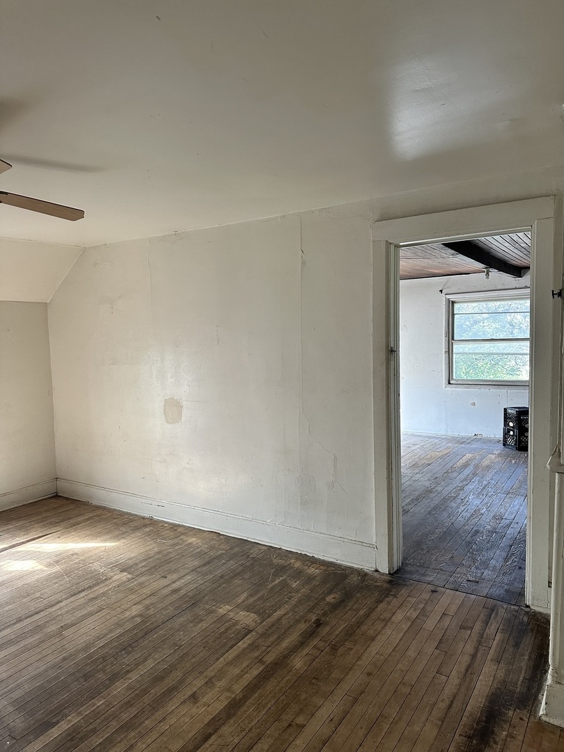 11730 South State Street Chicago, IL 60628 - Photo 3 of 11 a view of a room with wooden floor and window