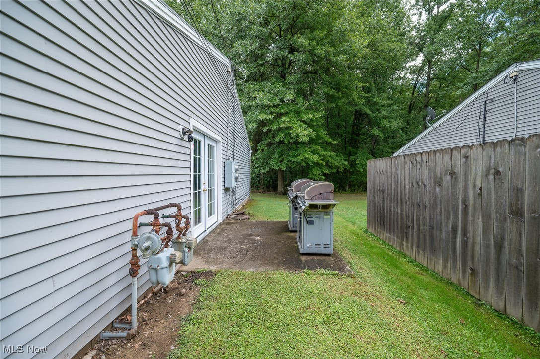 5546 Shaffer Road Northwest, Unit A & B Warren, OH 44481 - Photo 37 of 47 View of yard featuring view of scattered trees and a patio area