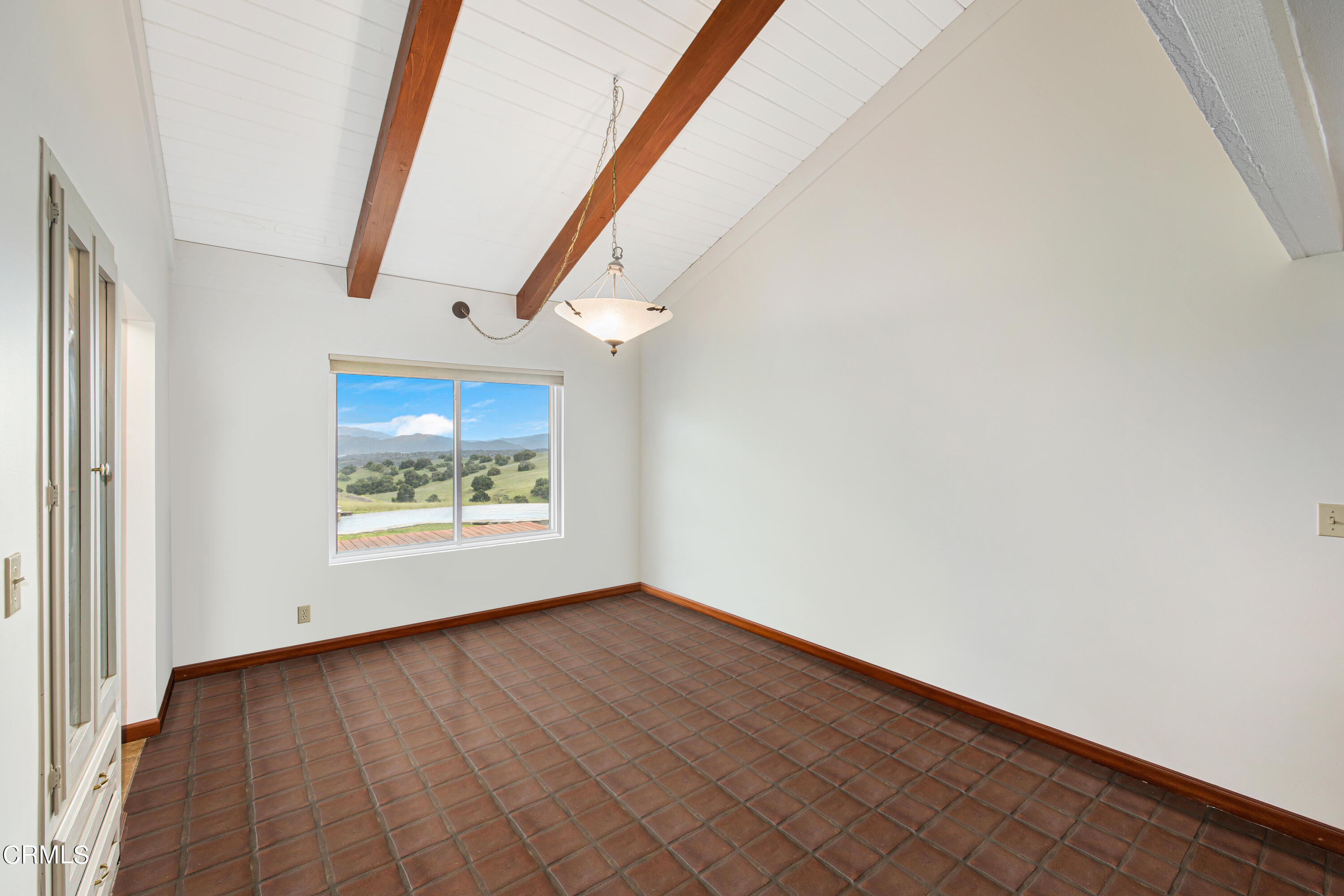 2851 Tapadero Road Solvang, CA 93463 - Photo 12 of 38 an empty room with wooden floor and door