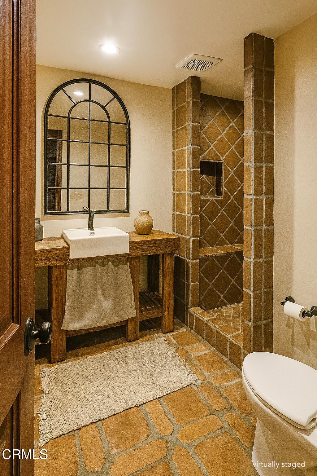 2851 Tapadero Road Solvang, CA 93463 - Photo 18 of 38 a bathroom with a sink toilet and shower