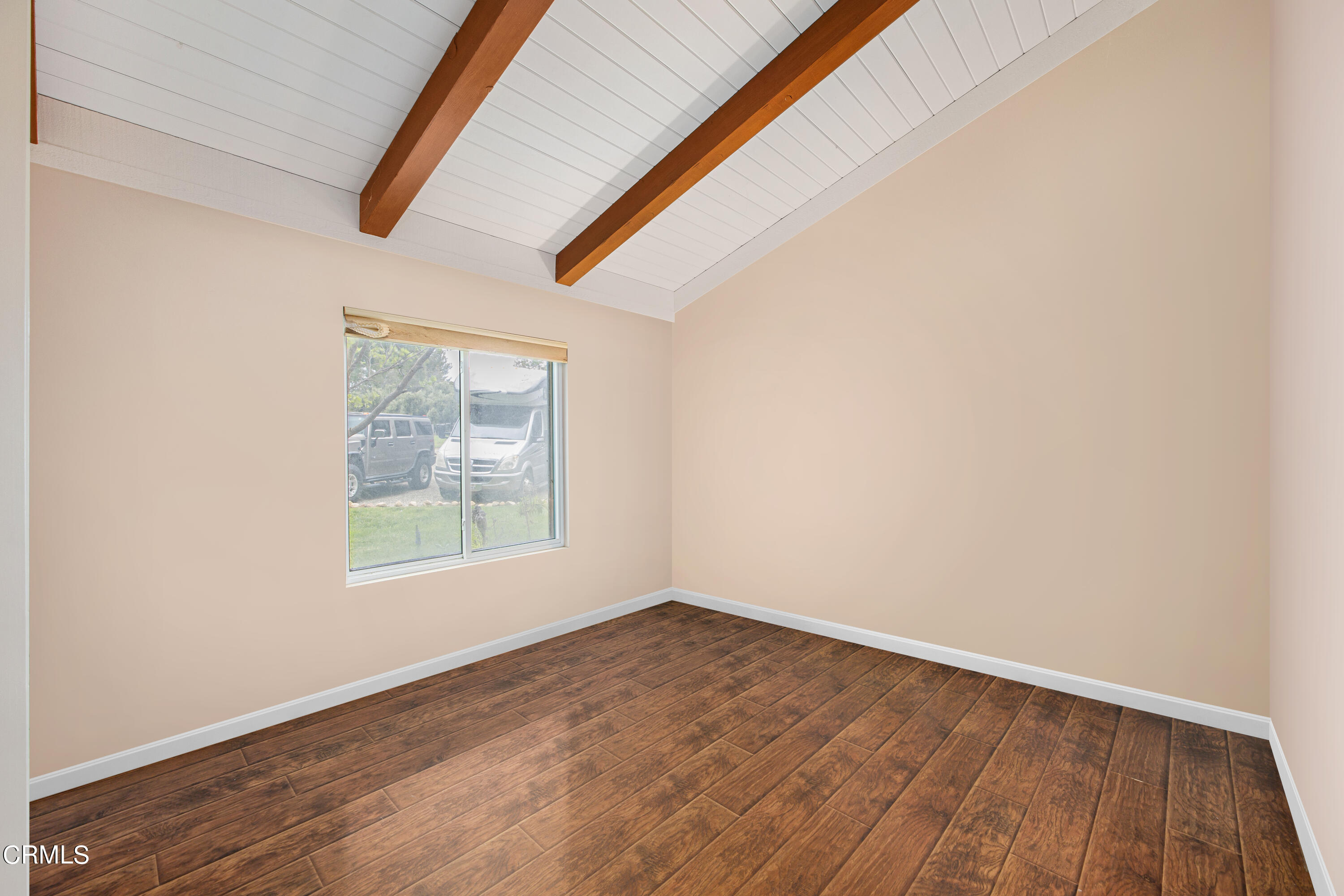 2851 Tapadero Road Solvang, CA 93463 - Photo 20 of 38 an empty room with wooden floor and windows