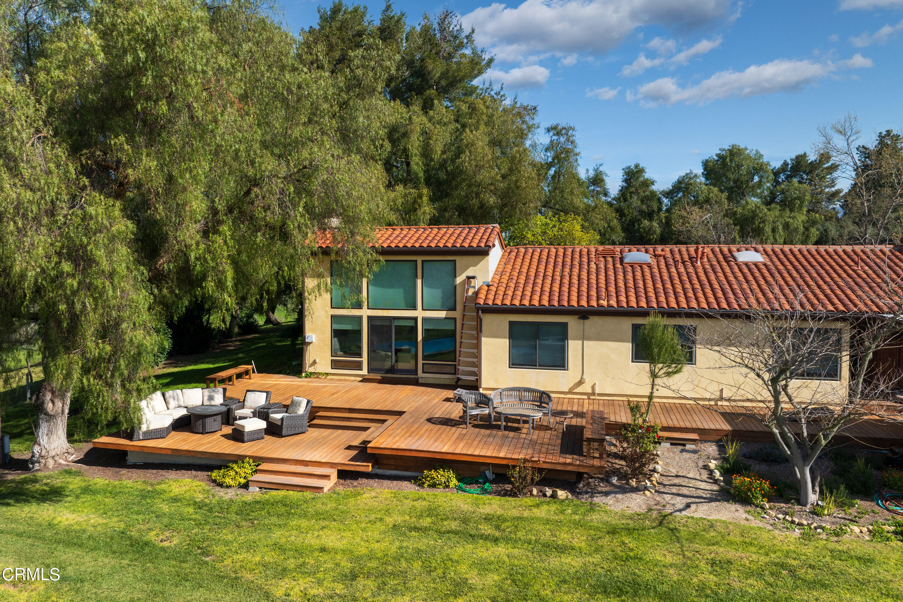2851 Tapadero Road Solvang, CA 93463 - Photo 23 of 38 a front view of a house with garden and sitting area