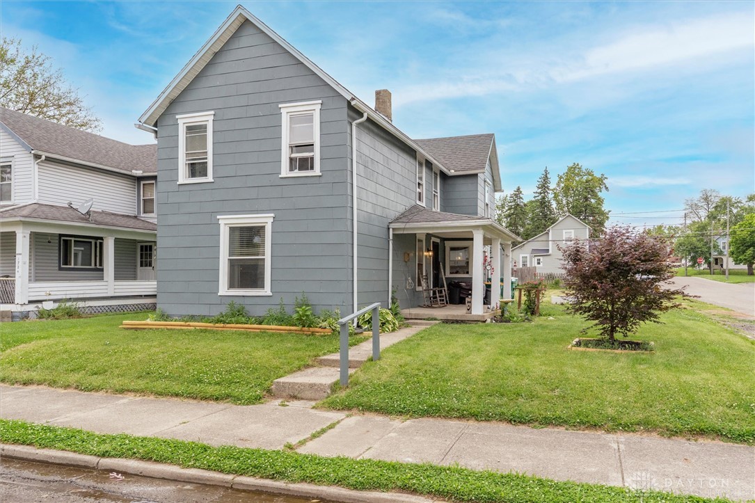 1726 Morgan Street Springfield, OH 45503 - Photo 1 of 30 This charming residence features a welcoming covered porch, mature landscaping, and a classic architectural style.