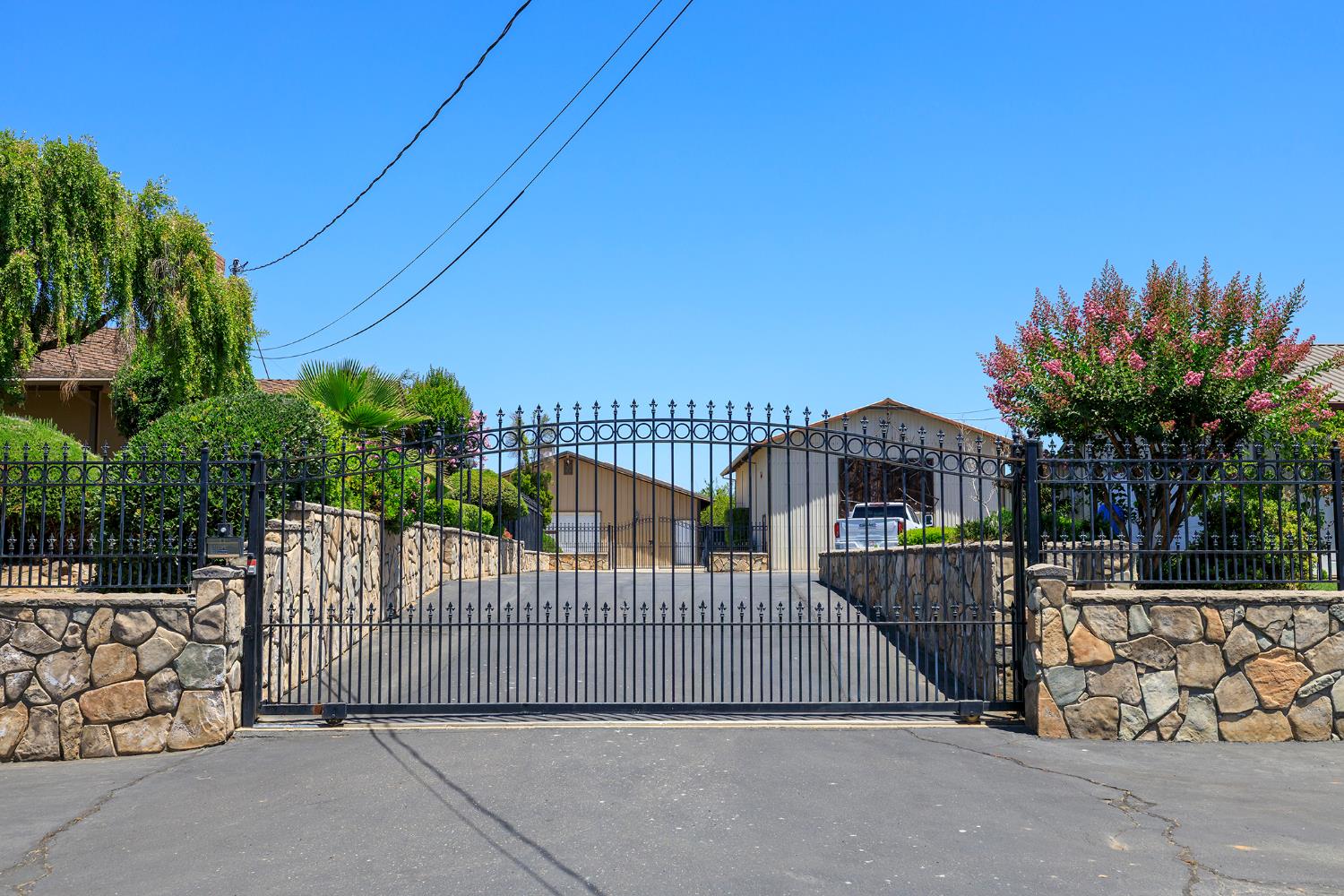 1800 Sperry Road Hughson, CA 95326 - Photo 1 of 1 a view of a wrought iron fences in front of house