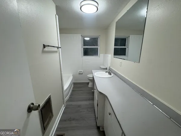 a bathroom with a sink and mirror
