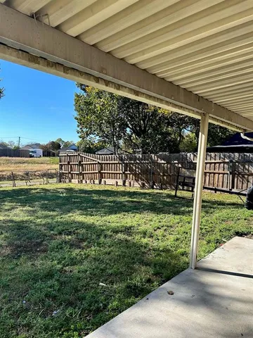 a view of a golf club with a backyard