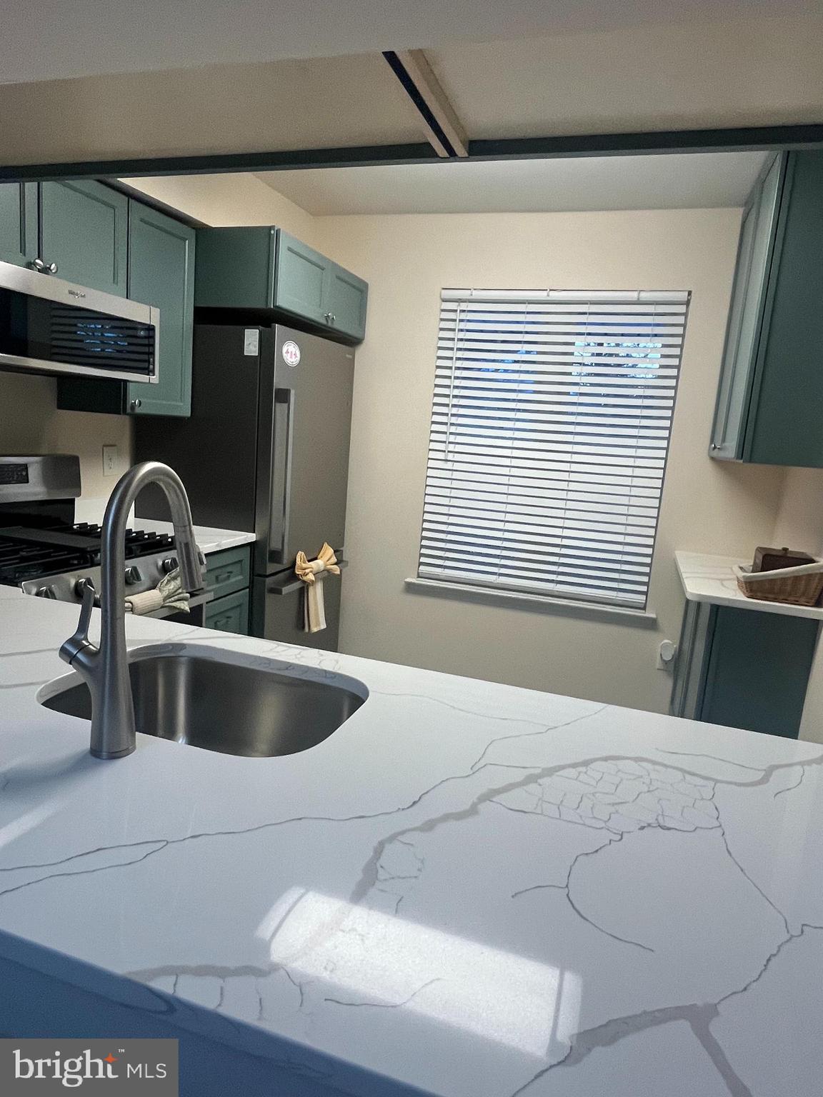 4503A Albridge Way Mount Laurel, NJ 08054 - Photo 4 of 15 a kitchen with a sink and a stove top oven