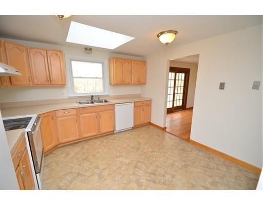 127 Leverett Road Amherst, MA 01002 - Photo 16 of 30 a kitchen with granite countertop a sink white cabinets and stainless steel appliances