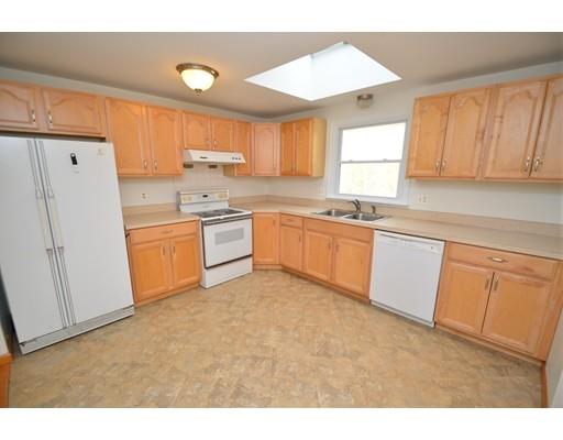 127 Leverett Road Amherst, MA 01002 - Photo 17 of 30 a kitchen with white cabinets and white appliances