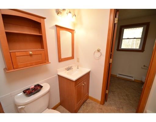 127 Leverett Road Amherst, MA 01002 - Photo 25 of 30 a kitchen with a refrigerator and cabinets