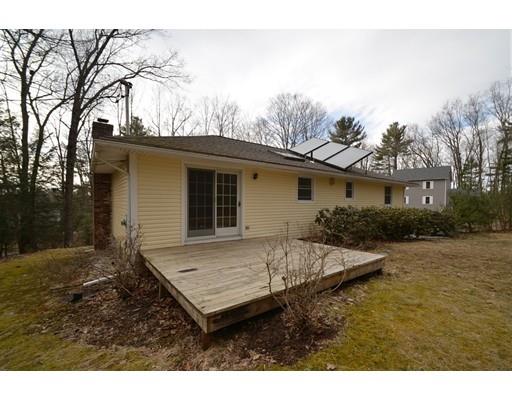 127 Leverett Road Amherst, MA 01002 - Photo 5 of 30 a view of a house with backyard and trees