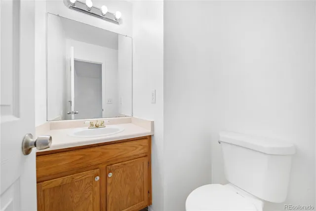 a view of a kitchen with a ceiling fan and a fireplace