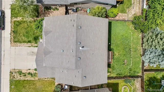 an aerial view of a house with swimming pool garden and patio