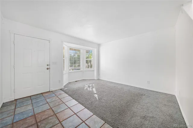 a view of an empty room and window