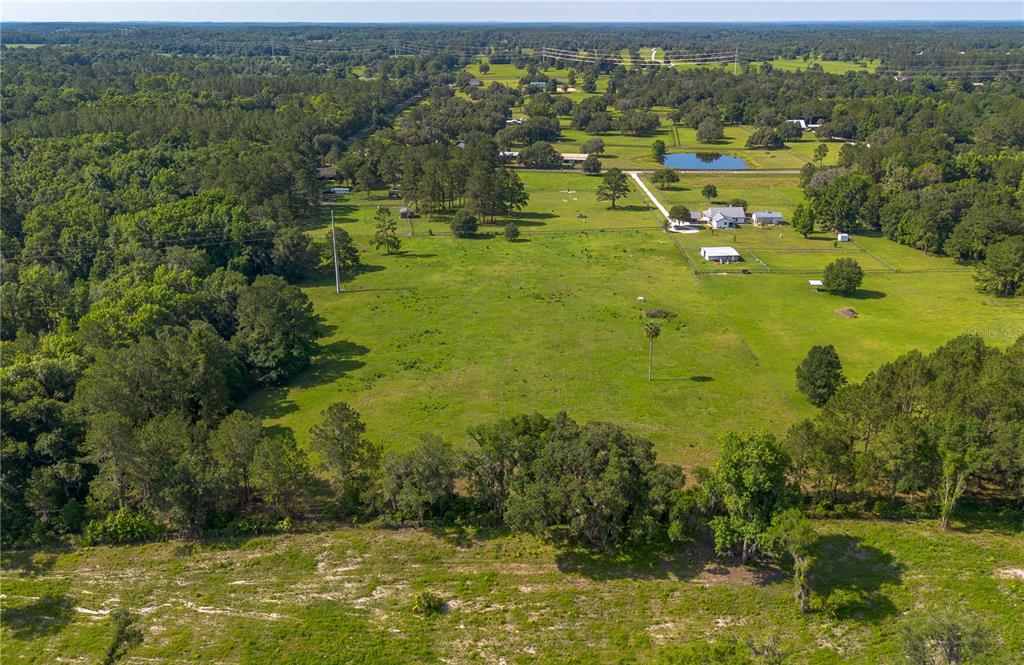 Tbd Northwest 185th Street Williston, FL 32696 - Photo 3 of 14 a view of a lake with houses