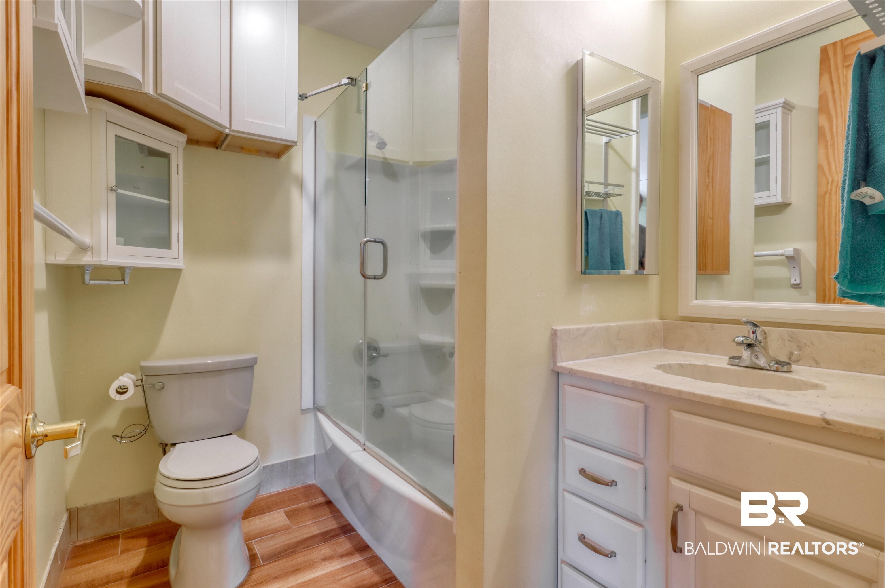 28461 Gardner Road Elberta, AL 36530 - Photo 14 of 46 Bathroom with vanity, combined bath / shower with glass door, and light wood-style floors