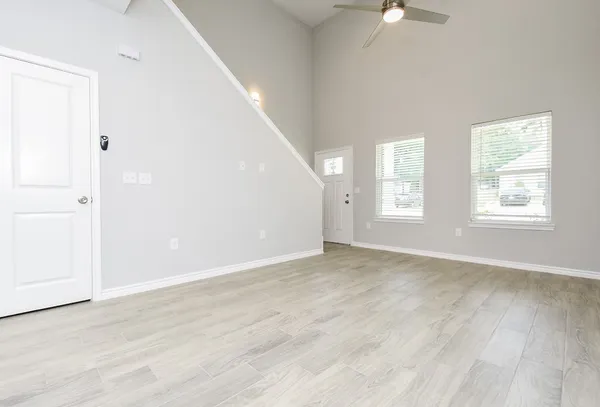 a view of a kitchen with a sink and a refrigerator