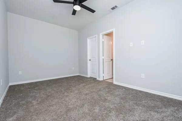 an empty room that has a window in it