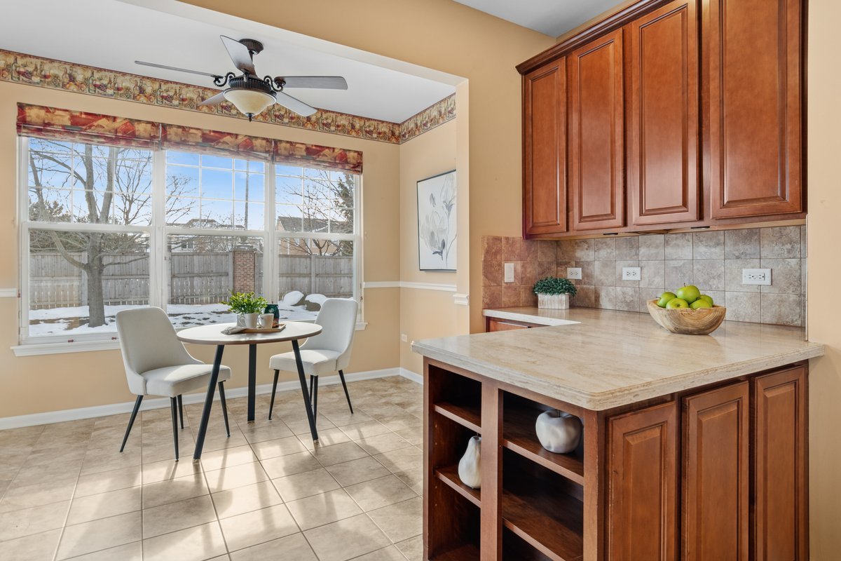 2905 Normandy Circle Naperville, IL 60564 - Photo 7 of 45 a dining room with a table chairs and a dining table view