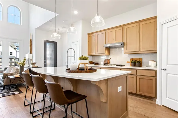 a kitchen with a sink cabinets and window