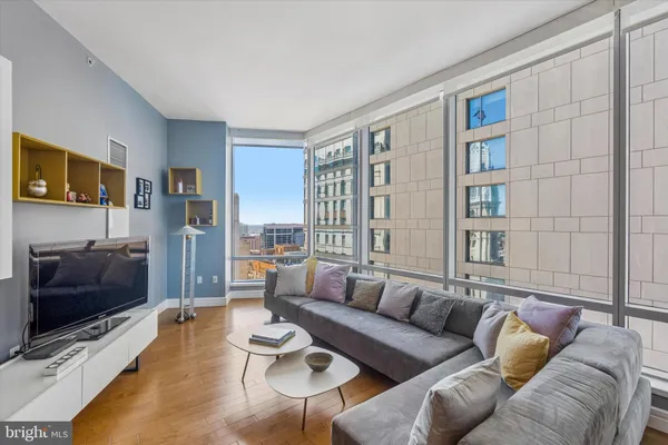 a living room with furniture and a flat screen tv