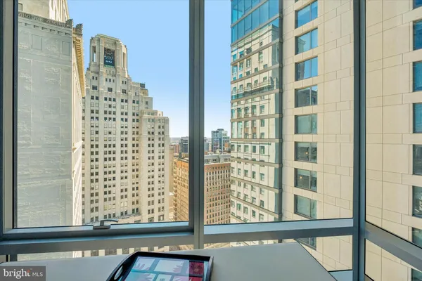 a view of a balcony with a floor to ceiling window