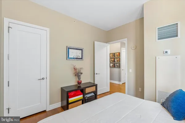 a bedroom with bed and a window