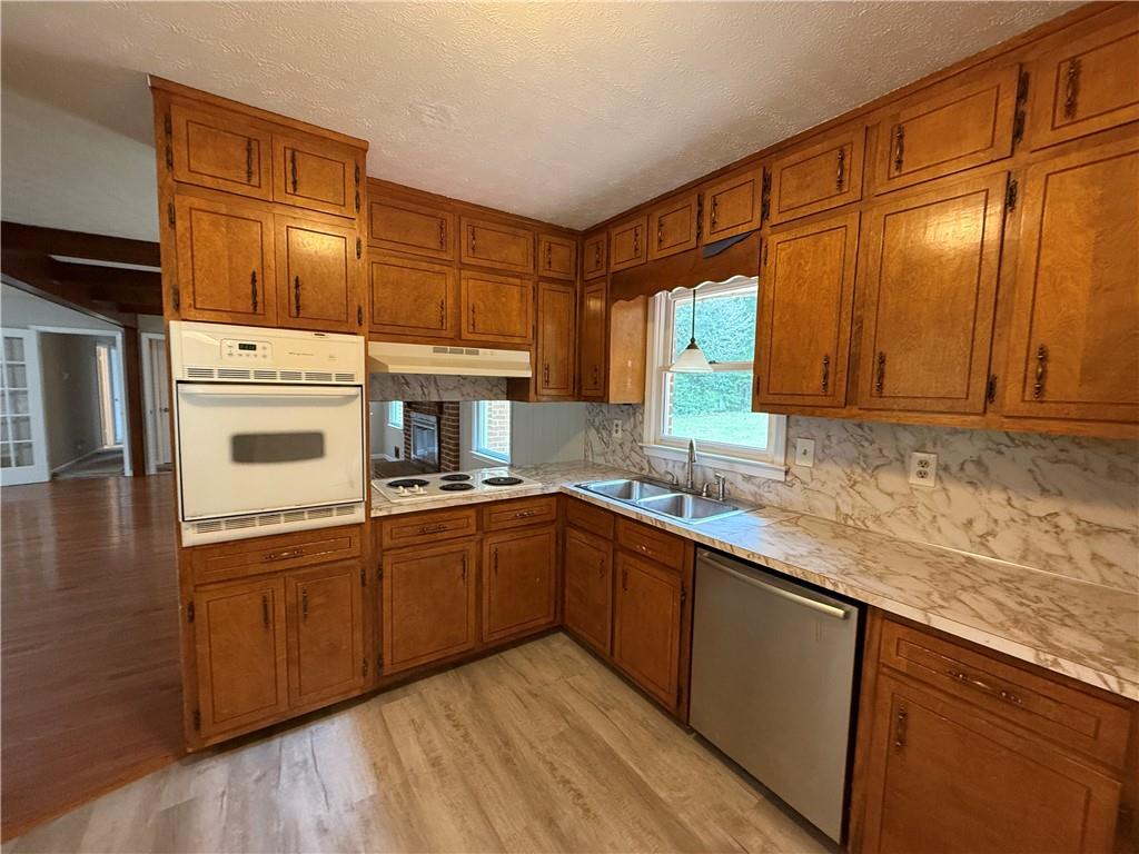 3155 Oak Drive Lawrenceville, GA 30044 - Photo 15 of 46 a kitchen with stainless steel appliances granite countertop a sink and cabinets