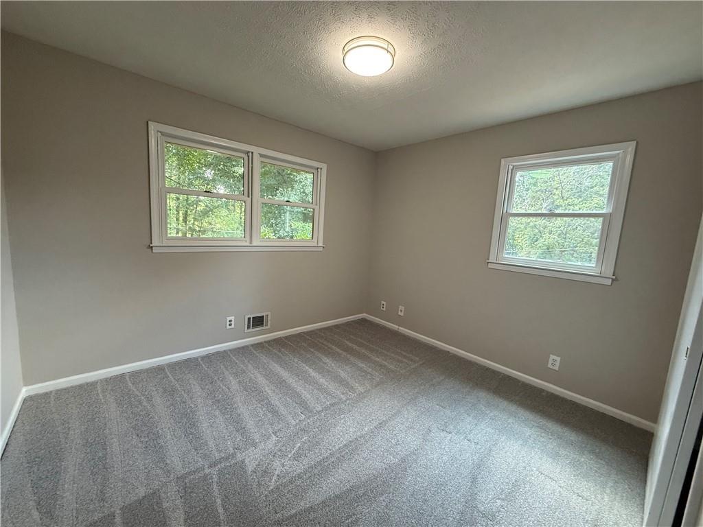 3155 Oak Drive Lawrenceville, GA 30044 - Photo 4 of 46 a view of an empty room with a window