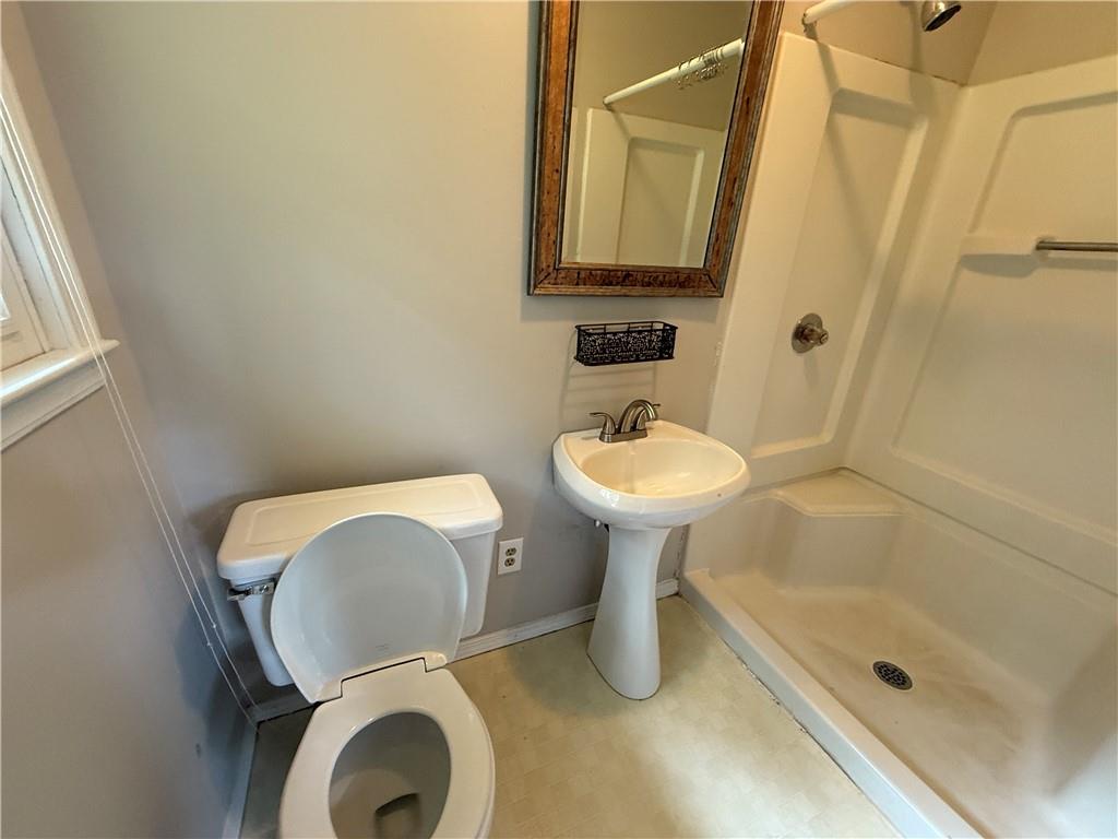 3155 Oak Drive Lawrenceville, GA 30044 - Photo 43 of 46 a bathroom with a sink toilet and shower