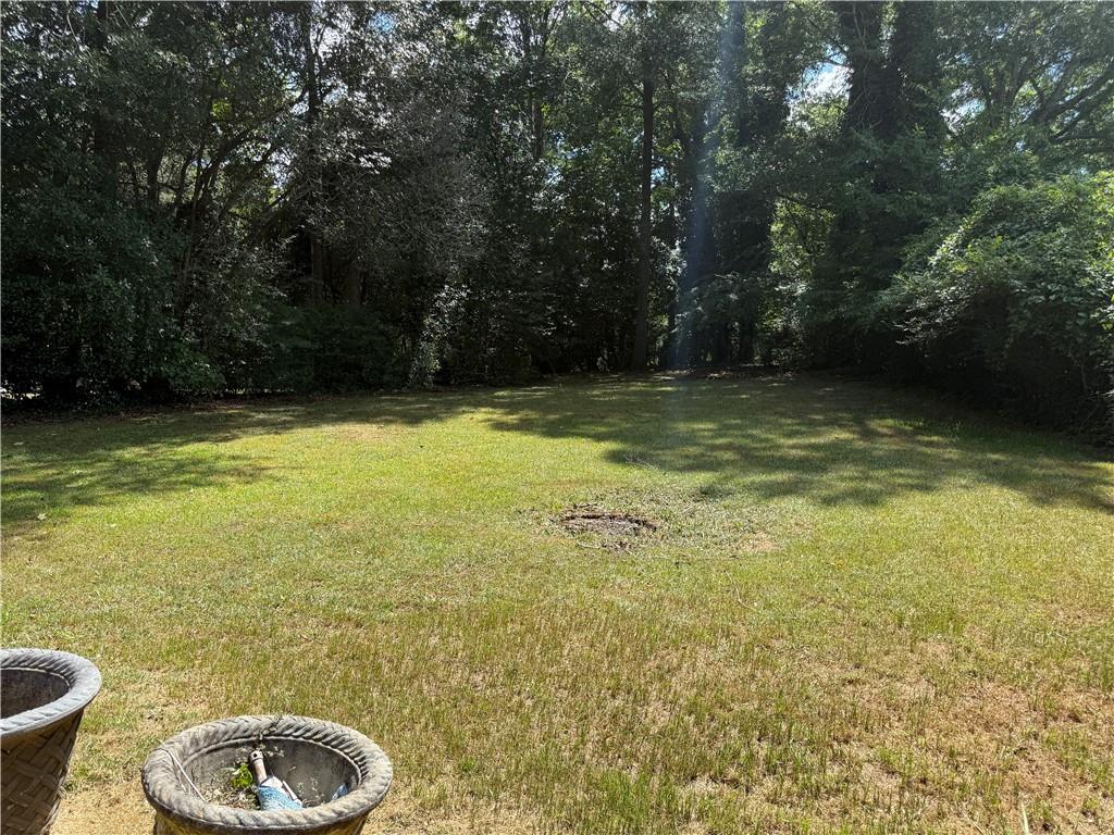 3155 Oak Drive Lawrenceville, GA 30044 - Photo 8 of 46 a view of a swimming pool and a yard