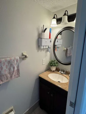 a white toilet sitting next to a small bathroom