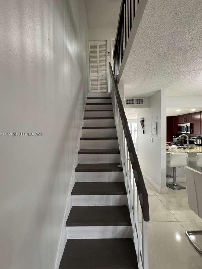 5083 West 12th Lane, Unit D6 Hialeah, FL 33012 - Photo 6 of 16 a view of entryway and hall