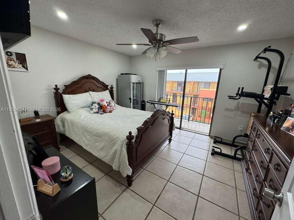 5083 West 12th Lane, Unit D6 Hialeah, FL 33012 - Photo 10 of 16 a bedroom with a bed and a window
