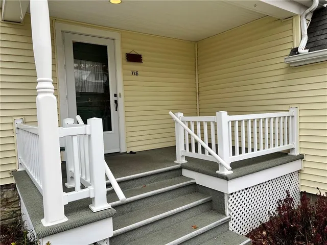 a view of a wooden deck with a bench