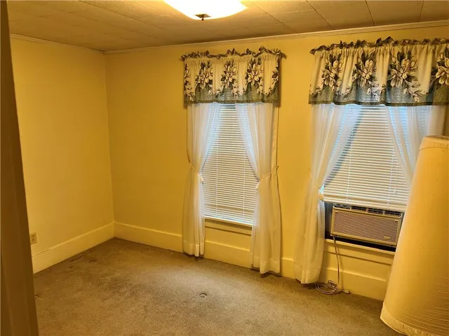 a view of walk in closet with clothes