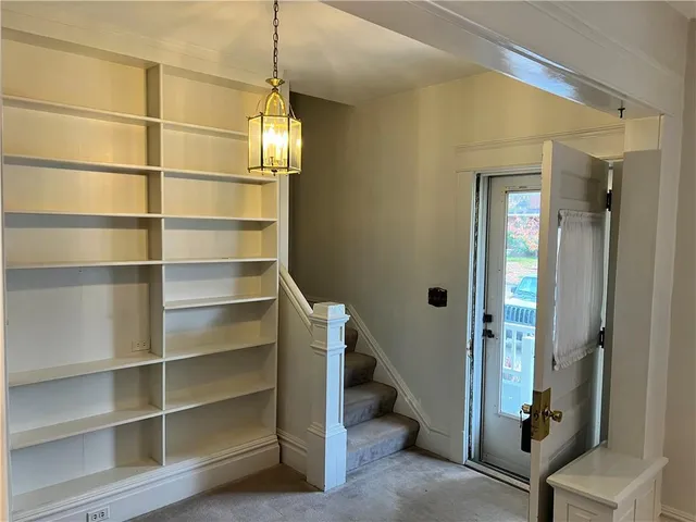 a view of a livingroom with a staircase