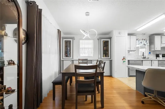 a view of a dining room with furniture and a livingroom