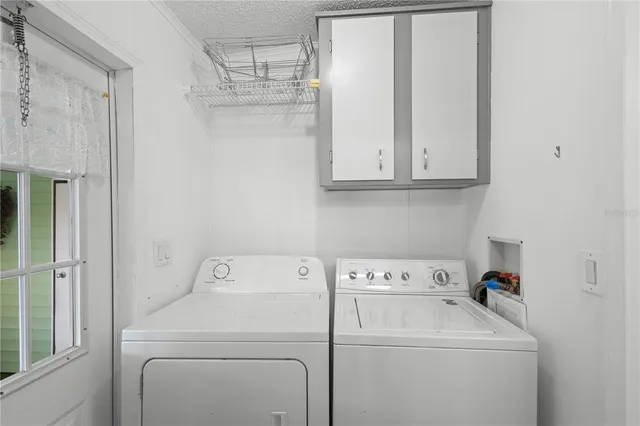 a view of storage and utility room with washer and dryer
