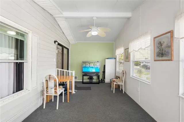 a view of a livingroom with furniture and a fireplace