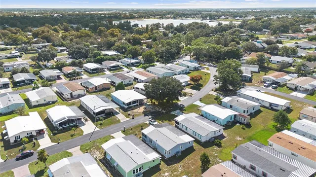 an aerial view of residential house with parking