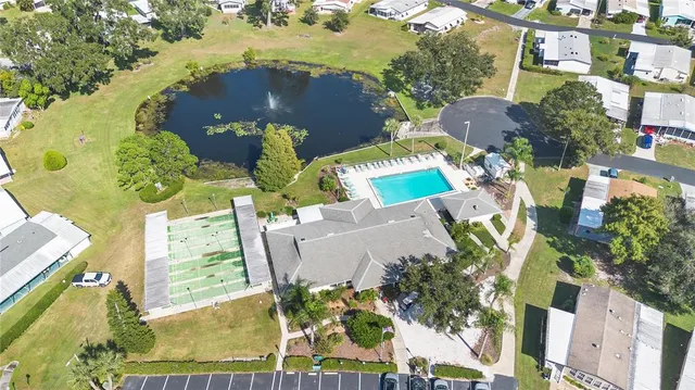 an aerial view of a house with a swimming pool
