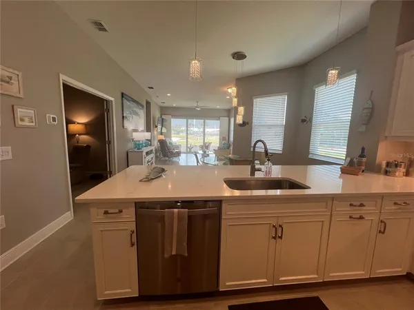 a kitchen with a sink and cabinets